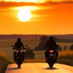 2 bikers riding into the sunset